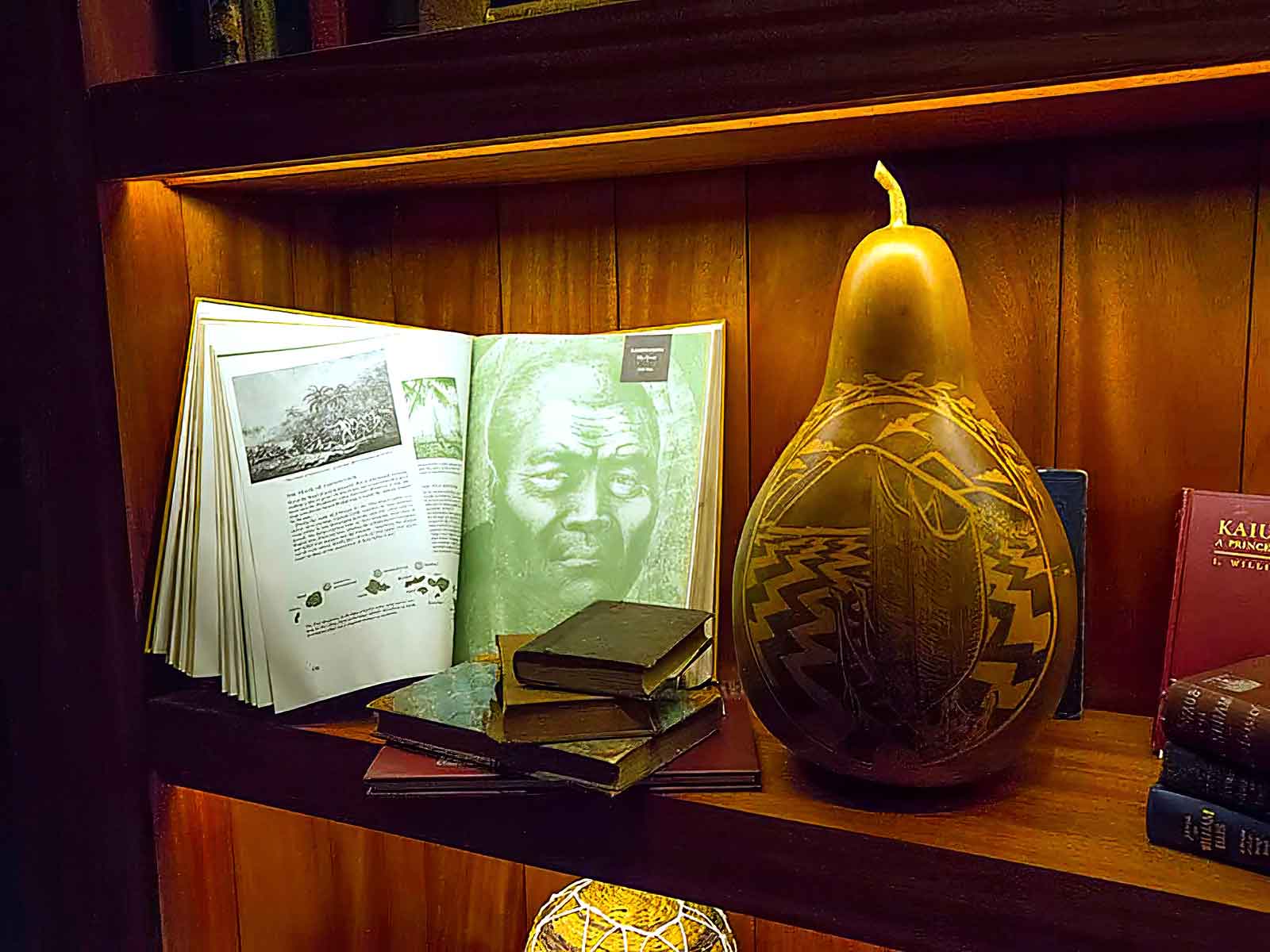  Permanent Historical Collection | Kukio Resort | Detail of koa display cases and fixtures featuring cultural history artifacts 