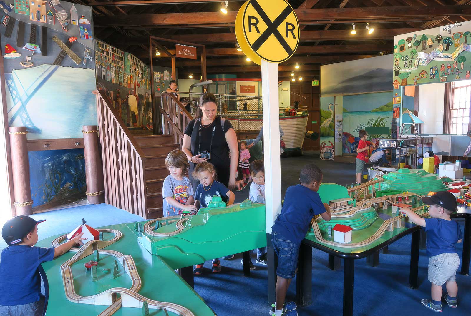  Wooden Train Tables | Bay Area Discovery Museum | Multi-element play environment including model container ship with working crane 